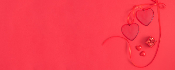 Two red heart on red background for banner. Monochromatic effect. Love and Saint valentine Day modern concept. Copy space