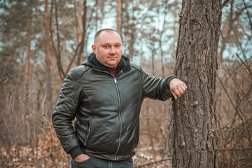 Plus size European man at forest, portrait of handsome man