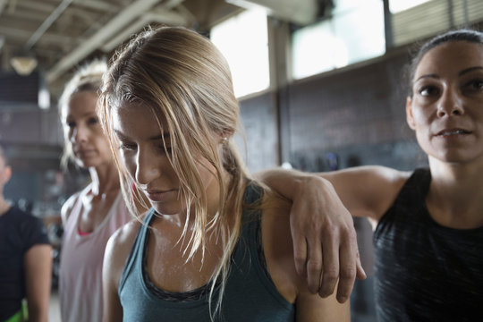 Tough, Tired Women Resting In Gym Post Workout