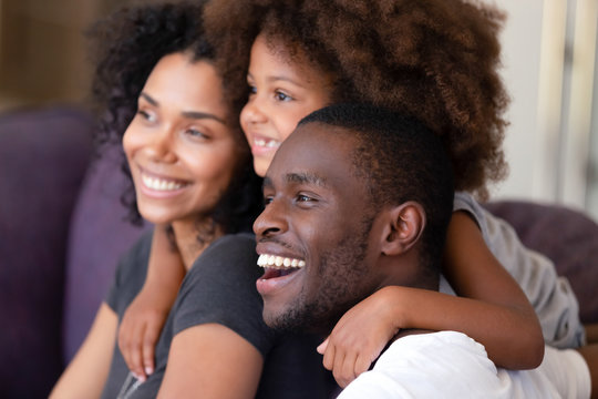 Excited African American Family Dream Of Bright Future Together