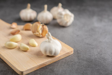 Garlic on the black table. High angle view.