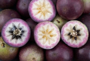 Purple star apple fruit or cainito fruits as background