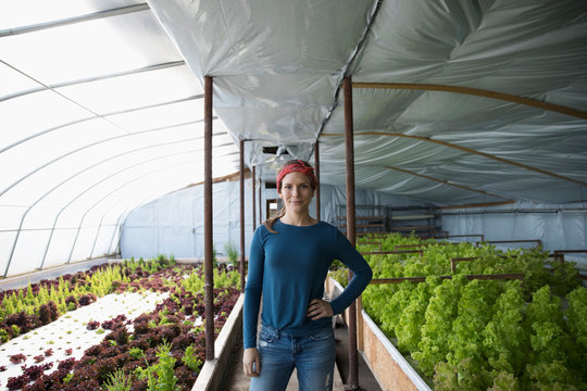 Portrait confident female farmer in greenhouse
