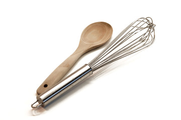 kitchen utensil with silver egg whisk on a white background
