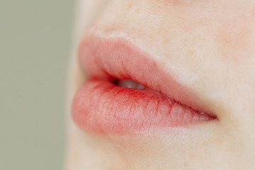 Lips after permanent makeup in beauty salon