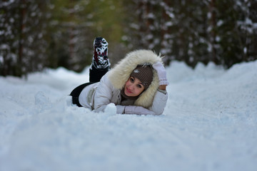 Girl in the winter frosty forest