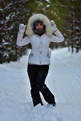 Girl in the winter frosty forest
