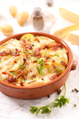baked potato, bacon and cheese- french traditional tartiflette