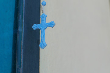 Small blue religious cross