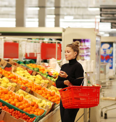 Woman buying fruits at the market	