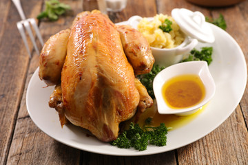 roasted chicken , mashed potato and sauce