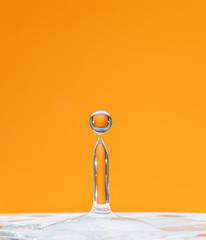 raindrop falling with orange background