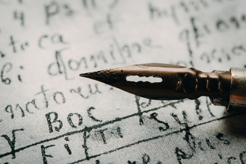 Fountain pen on an ancient handwritten letter. Old story. Retro style.