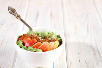 Breakfast with oatmeal and fruit.