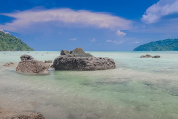 Obraz premium view of arch rocks in blue-green sea with blue sky background, Khao Chong Kad Bay, Surin island, Mu Ko Surin National Park, Phang Nga, southern of Thailand.