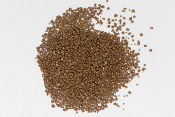 Confectionery milk chocolate in dragee on a white background
