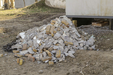 Construction waste from bricks, cement, plaster and many others in private territory