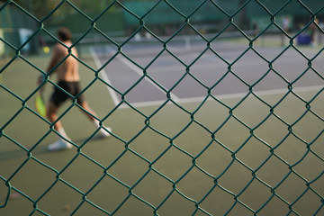 Fototapeta premium chain link fence on a background of blue sky