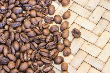 Roasted coffee beans on basketry. Coffee beans on North of Thaailand.