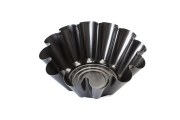 Moldes para tortas y bizcochos y flanes de acero inoxidable teflón sobre fondo blanco aislado. Vista de frente superior