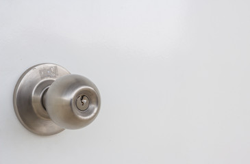 Obraz na płótnie Canvas Aluminum door knob on the white door skin.