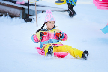 Asian girls playing snow happily in japan. ,  Children playing in the snow , Children playing in the snow happily.Asian boy playing snow happily in japan.