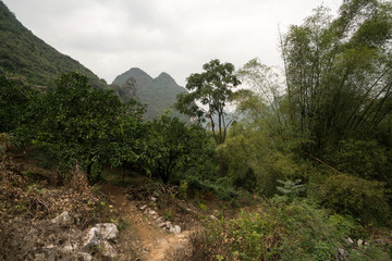 Fototapeta na wymiar Hiking in the Karst mountains in Guilin region of South China, close to Xingping village, Li River