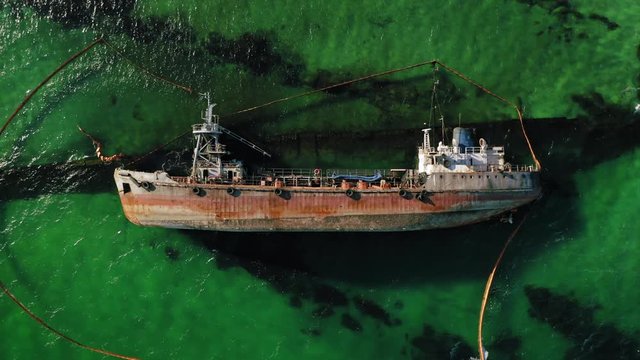 Aerial drone top down flight over crushed tanker ship Delfi in Black sea near Odessa, Ukraine, 4K