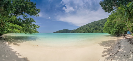 view panorama 180 degree on white sand beach with blue-green sea and blue sky background, Mai Ngam Beach, Surin island, Mu Ko Surin National Park, Phang Nga, southern of Thailand. © Yuttana Joe