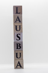 "Lausbua" made from wooden cubes with letters