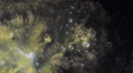 Reflection of colors in water, space, cosmos concept isolated on black background, nebula effect texture 