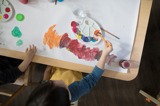 Preschool Boy Painting In Art Classroom