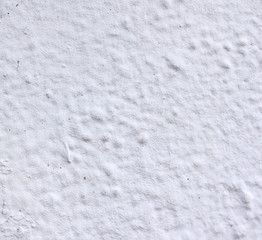 white wall with paint, scuffs and old white