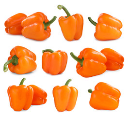 Set of ripe orange bell peppers on white background