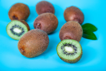 Ripe kiwi on a blue background