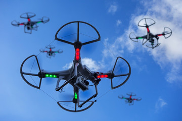 Miniature drones equipped with camera in flight
