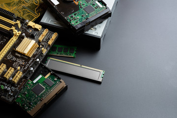 group of old and used computer component part on dark background.  recycle and electronic waste concept.