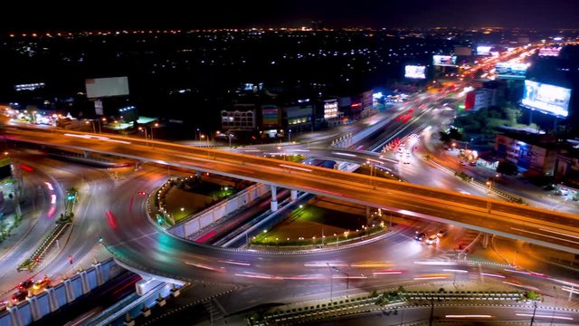 Timelapse hyperlapse rotate aerial of a circle intersection in bangkok at night. 4K Prores