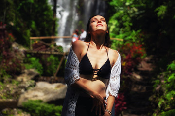 Woman near Labuhan Kebo Waterfall located in Munduk, Bali