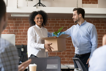 Boss acquaint black female worker with company colleagues