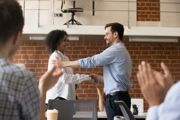 Boss handshake black newcomer congratulating with employment