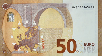 Fragment part of 50 euro banknote close-up with small brown details