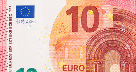 Fragment part of 10 euro banknote close-up with small red details