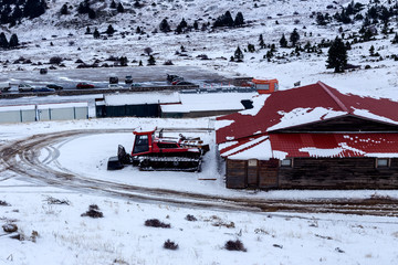 Naklejka premium A machine that clears snow in Kalavrita Ski Resort (Greece, Peloponnesus)