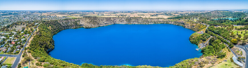 Obraz premium The Blue Lake is a crater lake located in a dormant volcanic maar of Mount Gambier in South Australia - aerial panoramic landscape