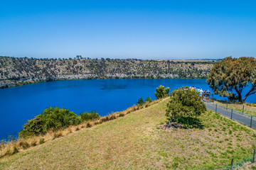 Fototapeta premium Aerial view of tourists admiring the Blue Lake in Mount Gambier, South Australia