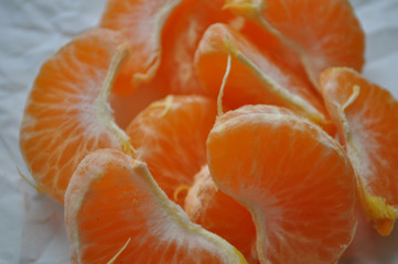 slices of mandarin closeup on a white background
