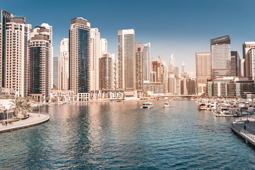Obraz na płótnie Canvas Panoramic views of the Marina district in Dubai with numerous residential skyscrapers hotels. Travel destinations in the UAE