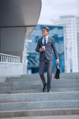 business man walking down the street of a big city