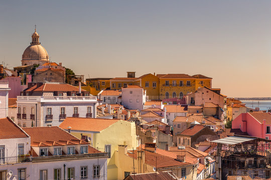 View of Lisbon from the Largo Portas do Sol at sunset